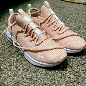 Pink puma lace up tennis shoes